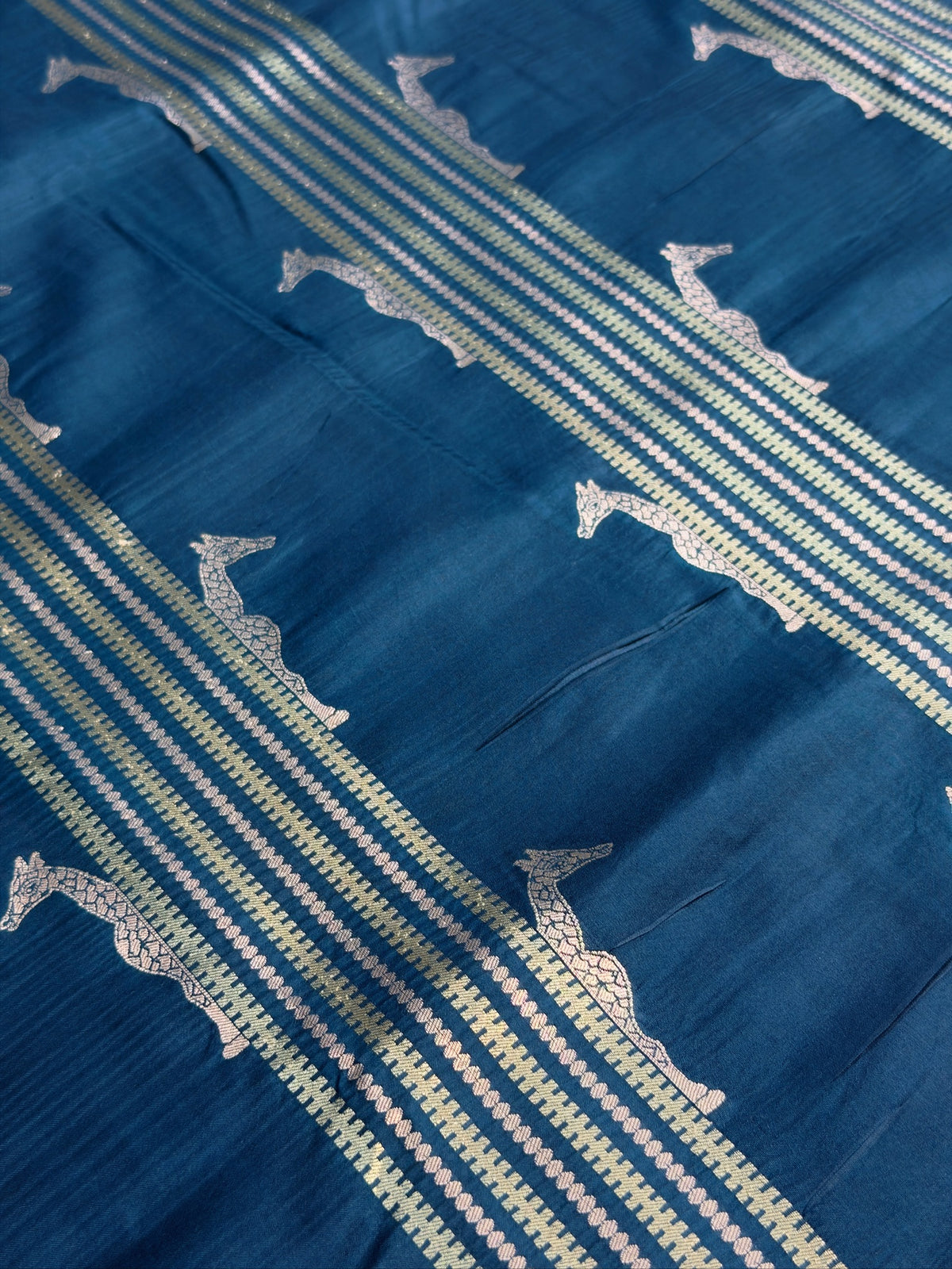 VIRASAT 364: Crystal Teal Blue Pure Katan Silk Saree with Gold & Silver Zari Animal Stripe Design