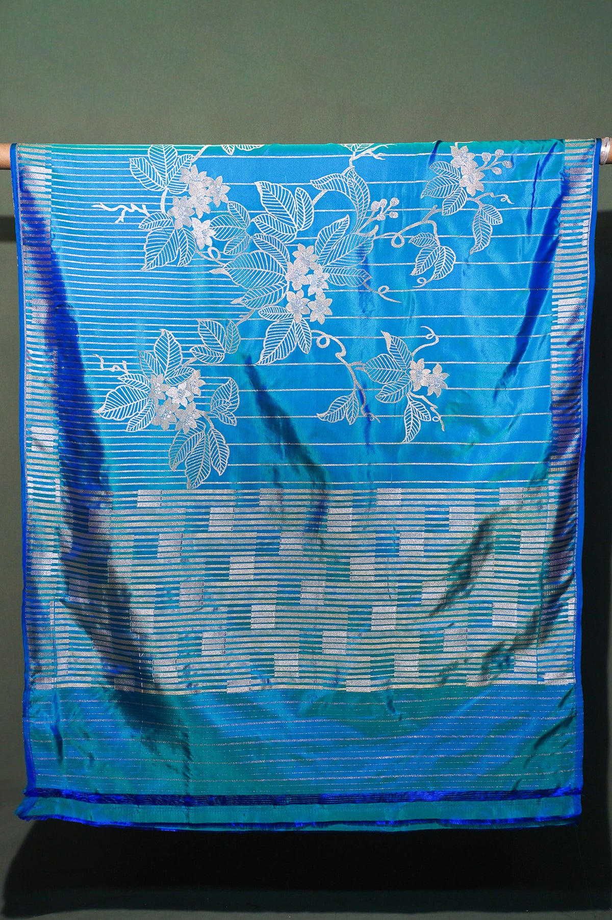 FOUNDER CHOICE 047: Turquoise Blue Katan Silk Saree with Silver Zari Floral Vine & Stripe Design