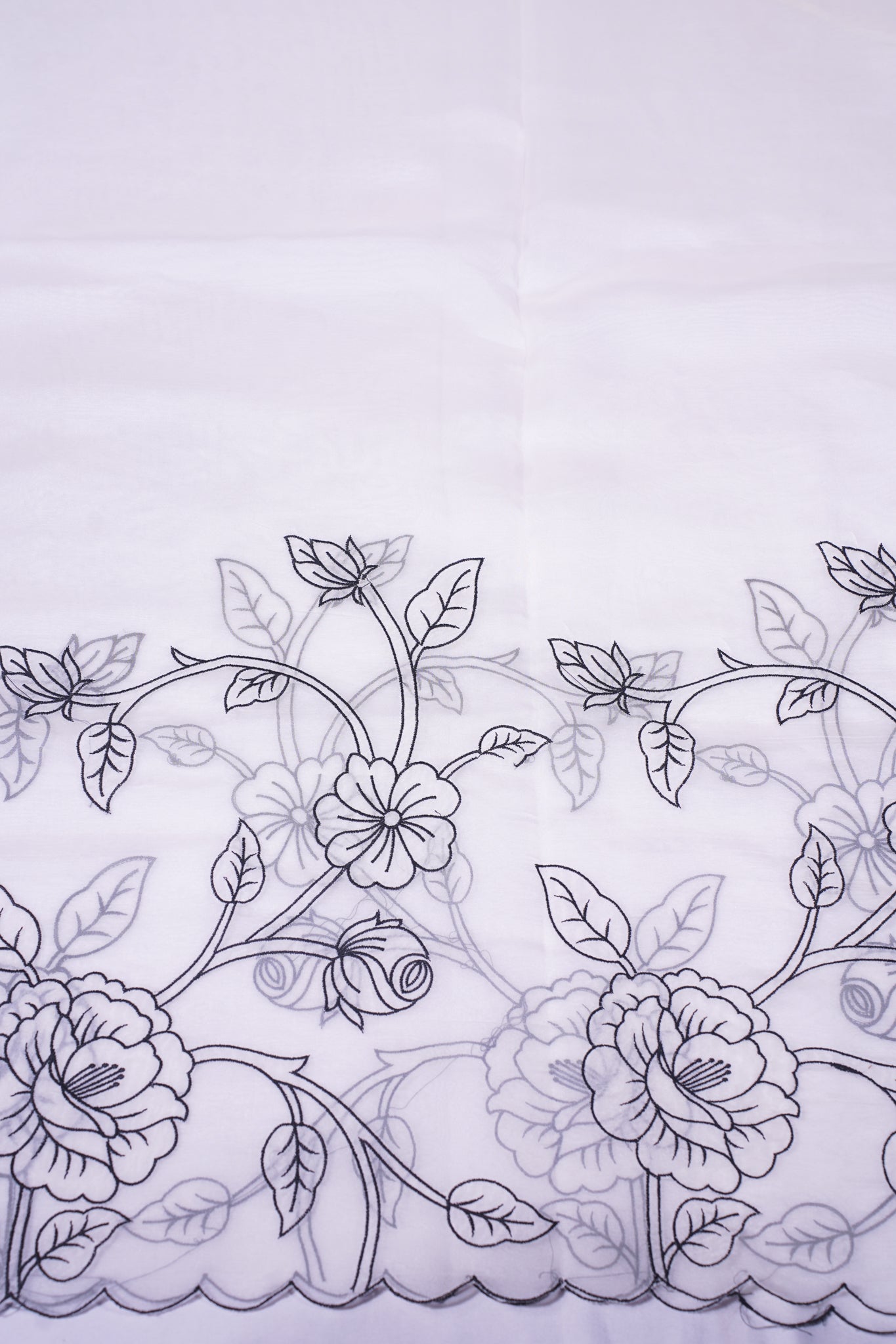 "UTSAV BANARAS 342" Banarasi Elegant White Applique Munga Silk Saree With Black Sketch Floral Embroidery & Scalloped Cutwork Border