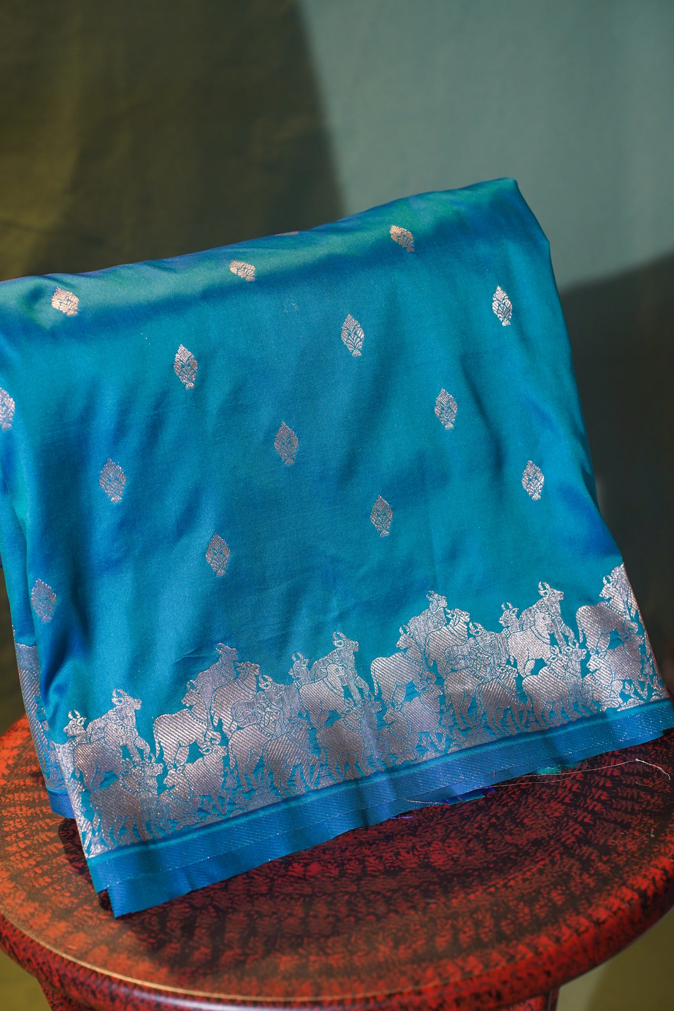 Teal Blue Raw Silk Banarasi Saree with Zari Buti &amp; Nandi Border