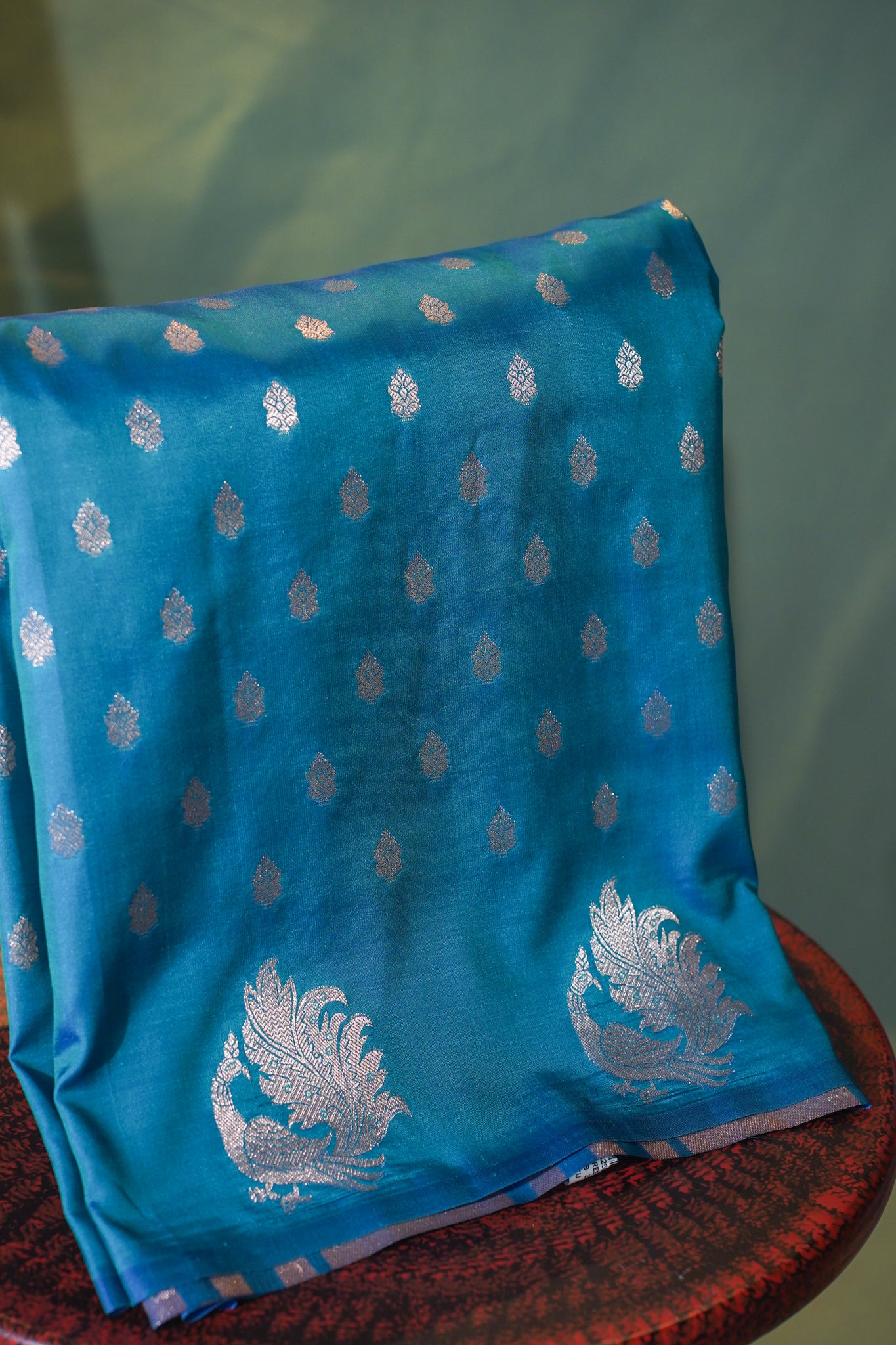 Turquoise Blue Raw Silk Banarasi Saree with Floral Buti &amp; Zari Peacock Border